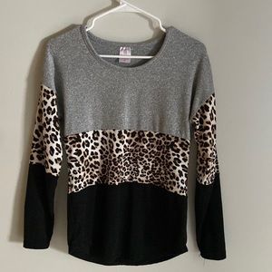 Gray, cheetah, and black long sleeve. Hardly worn.